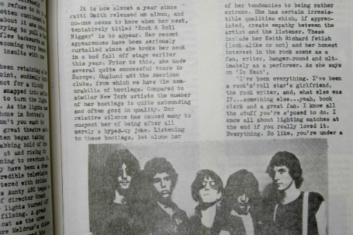 Detail of photocopied page with two columns of text and photo of five musicians